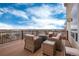 Enjoy the outdoor deck with wicker seating and gorgeous neighborhood views at 7360 Almandine Ct, Castle Rock, CO 80108