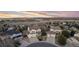 Inviting two-story home featuring a well-manicured front lawn, a two-car garage, and a charming entryway at 7360 Almandine Ct, Castle Rock, CO 80108