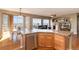 Kitchen view showcasing tile countertops, stainless steel appliances, and an open floor plan to living room at 7360 Almandine Ct, Castle Rock, CO 80108