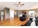 Open-concept living space connecting to a kitchen, dining area and hardwood floors at 7360 Almandine Ct, Castle Rock, CO 80108