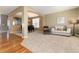 Spacious living room with hardwood floors and an open floor plan into the dining room at 7360 Almandine Ct, Castle Rock, CO 80108