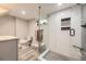 Modern bathroom with glass shower, gray and white tile, and contemporary vanity at 1640 Pontiac St, Denver, CO 80220