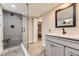 Stylish bathroom featuring glass shower, updated vanity, and tile flooring at 1640 Pontiac St, Denver, CO 80220
