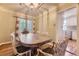 Charming dining room with french doors, hardwood floors, and elegant lighting at 1640 Pontiac St, Denver, CO 80220