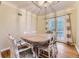 Elegant dining room with hardwood floors, chandelier, and french doors to outdoor space at 1640 Pontiac St, Denver, CO 80220
