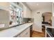 Bright kitchen with modern sink, stainless steel appliances, and charming window with hanging plants at 1640 Pontiac St, Denver, CO 80220