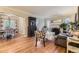 Bright and airy living room with hardwood floors, fireplace, and dining room view at 1640 Pontiac St, Denver, CO 80220