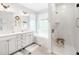 Luxurious bathroom with double vanity, soaking tub, and separate glass enclosed shower at 3320 Yukon Ct, Wheat Ridge, CO 80033