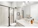 Chic bathroom with a glass-enclosed shower, modern fixtures, and stylish decor at 3320 Yukon Ct, Wheat Ridge, CO 80033