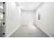 Spacious, empty room with fresh neutral paint, plush carpeting and a window with natural light at 3320 Yukon Ct, Wheat Ridge, CO 80033