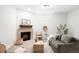 Cozy living room with a stylish fireplace, comfortable seating, and natural light at 3320 Yukon Ct, Wheat Ridge, CO 80033