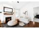 Cozy living room with a fireplace, comfortable seating, and modern decor, perfect for relaxation at 3320 Yukon Ct, Wheat Ridge, CO 80033