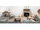 Inviting living room with a fireplace, unique decor, and comfortable seating arrangement at 3320 Yukon Ct, Wheat Ridge, CO 80033
