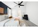 Spacious main bedroom with a feature wall, ceiling fan, and neutral-toned décor at 3320 Yukon Ct, Wheat Ridge, CO 80033