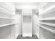 Well-organized walk-in closet with ample shelving and hanging space at 3320 Yukon Ct, Wheat Ridge, CO 80033