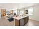 Spacious open-concept kitchen with stainless steel appliances and a large island for dining and entertaining at 4312 Gypsum Ave, Mead, CO 80504
