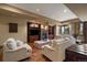 Inviting basement living space features a stone fireplace, built-in shelves, and comfortable sofas at 214 Equinox Dr, Castle Rock, CO 80108