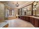 Luxurious bathroom with a jetted tub, walk-in shower, and vanity with dual sinks at 214 Equinox Dr, Castle Rock, CO 80108