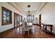 Formal dining room with hardwood floors, decorative ceilings and an elegant chandelier at 214 Equinox Dr, Castle Rock, CO 80108