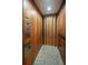 This home features a private residential elevator with wood paneling and a folding door at 214 Equinox Dr, Castle Rock, CO 80108