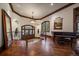 Elegant home foyer featuring wood floors, staircase, and a beautiful chandelier at 214 Equinox Dr, Castle Rock, CO 80108