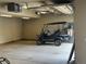Spacious garage featuring a golf cart, high ceilings, and ample room for storage at 214 Equinox Dr, Castle Rock, CO 80108
