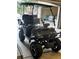 This black golf cart features great tires, high seats, and a sunshade at 214 Equinox Dr, Castle Rock, CO 80108