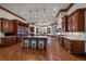 Gourmet kitchen featuring custom cabinets, granite counters, and stainless steel appliances at 214 Equinox Dr, Castle Rock, CO 80108