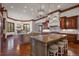 Gourmet kitchen featuring custom cabinets, granite counters, and stainless steel appliances at 214 Equinox Dr, Castle Rock, CO 80108