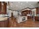 Spacious kitchen with wood floors, custom cabinets, double islands, and high-end appliances at 214 Equinox Dr, Castle Rock, CO 80108