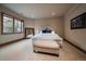 Comfortable main bedroom with large bed, neutral carpeting, and a window with natural light at 214 Equinox Dr, Castle Rock, CO 80108