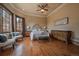 Elegant main bedroom with hardwood floors, decorative ceiling trim, and ample natural light at 214 Equinox Dr, Castle Rock, CO 80108