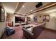 Home theater room with large screen, comfortable seating, and a popcorn machine at 214 Equinox Dr, Castle Rock, CO 80108