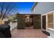 Wide angle shot of a backyard deck with a partially covered seating area with a table and chairs at 13818 Krameria St, Thornton, CO 80602