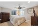 Bedroom featuring a ceiling fan, recessed lights, a dresser, and two windows at 13818 Krameria St, Thornton, CO 80602