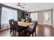 Inviting dining room with hardwood floors and large windows to provide natural light at 13818 Krameria St, Thornton, CO 80602
