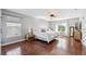 Spacious main bedroom featuring wood floors, neutral walls, and a ceiling fan at 13818 Krameria St, Thornton, CO 80602
