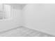 Clean and well-lit bedroom with neutral carpeting at 2090 Eliot St, Denver, CO 80211