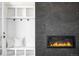 Modern fireplace with a stone surround and built-in shelving at 2090 Eliot St, Denver, CO 80211