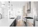 Contemporary kitchen with a center island and modern lighting at 2090 Eliot St, Denver, CO 80211