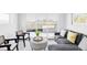 Bright living room with floor to ceiling sliding glass doors that lead to a balcony at 2090 Eliot St, Denver, CO 80211