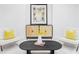 Comfortable sitting room with stylish furnishings and contemporary finishes at 2090 Eliot St, Denver, CO 80211