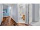 Clean bathroom with a shower/tub combo and wood vanity at 11480 Moline St, Commerce City, CO 80640