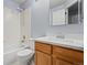Updated bathroom with wood vanity and new countertop at 11480 Moline St, Commerce City, CO 80640