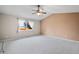 Primary bedroom with vaulted ceiling and ceiling fan at 11480 Moline St, Commerce City, CO 80640