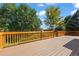 Back deck with wooden railings and yard view at 11480 Moline St, Commerce City, CO 80640
