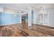 Open dining area with hardwood floors and access to other rooms at 11480 Moline St, Commerce City, CO 80640
