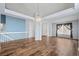 Spacious dining room with hardwood floors and vaulted ceiling at 11480 Moline St, Commerce City, CO 80640