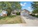 Brick ranch home with attached garage and landscaped lawn at 11480 Moline St, Commerce City, CO 80640