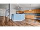Bright kitchen with light wood cabinets, stainless steel appliances, and a breakfast bar at 11480 Moline St, Commerce City, CO 80640